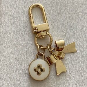 Authentic vintage cream Louis Vuitton flower charm